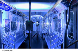 Germicidal UVC light sanitizing the inside of a subway car